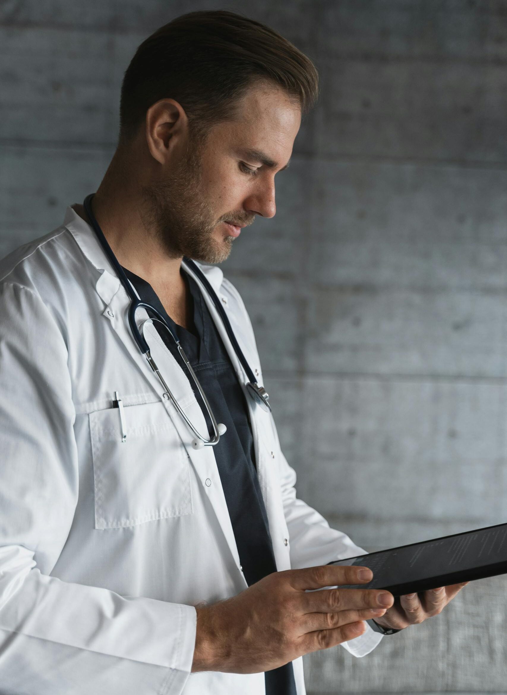 male doctor using a tablet indoors.